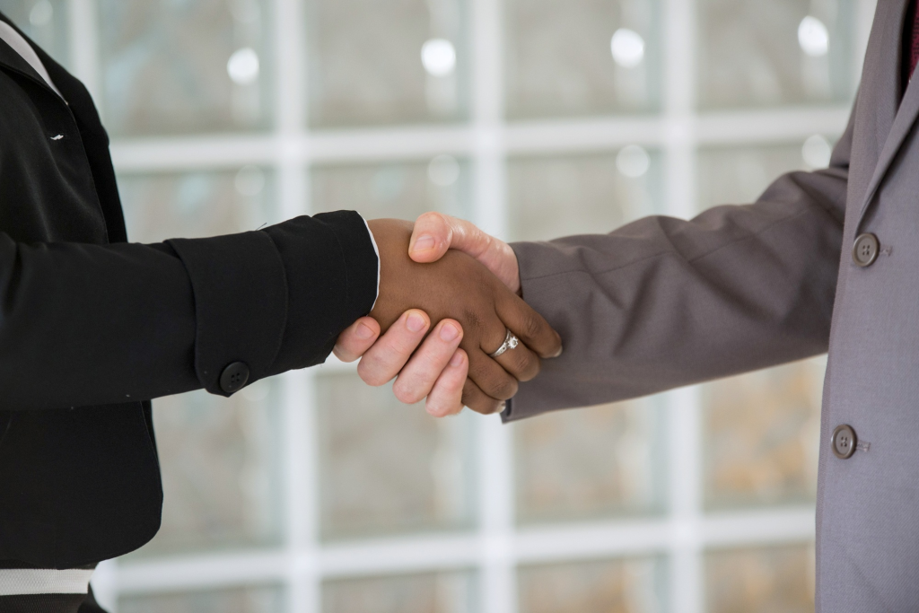 SACC Career Center graduate shaking hands with employer after successful job placement