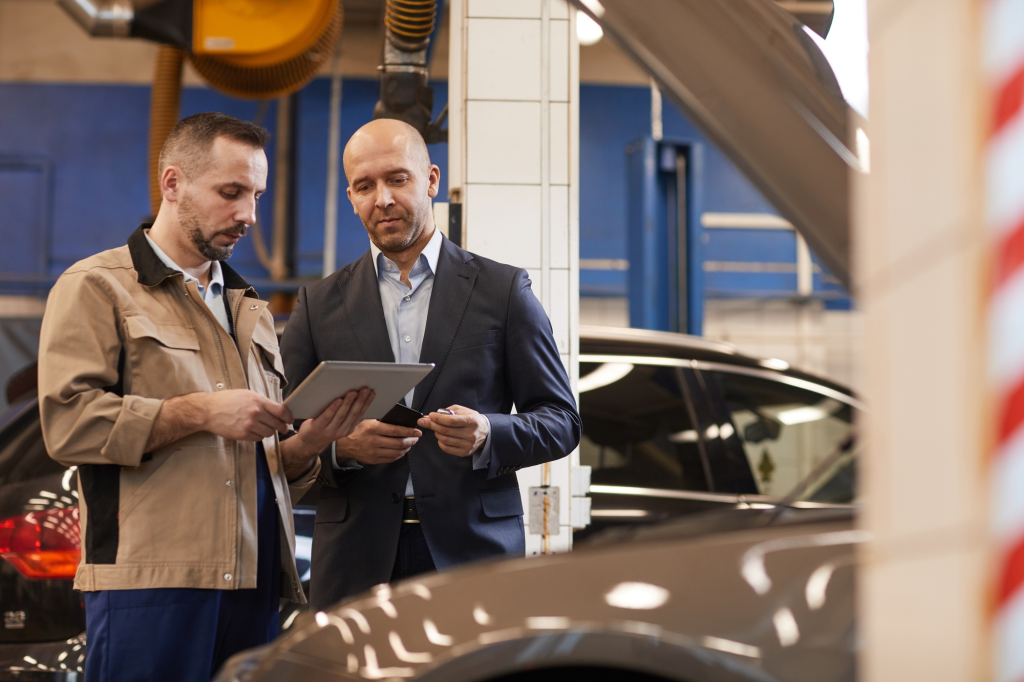 SACC Career Center automotive training instructor guiding student through hands-on repair lesson