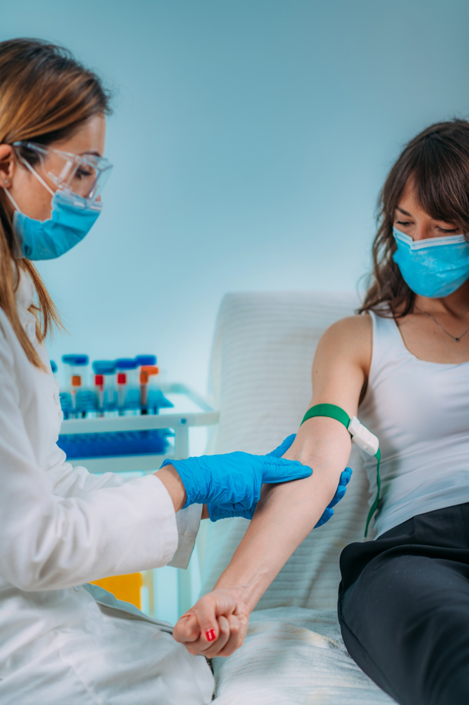 SACC Career Center phlebotomy student practicing venipuncture under supervision in clinical training lab